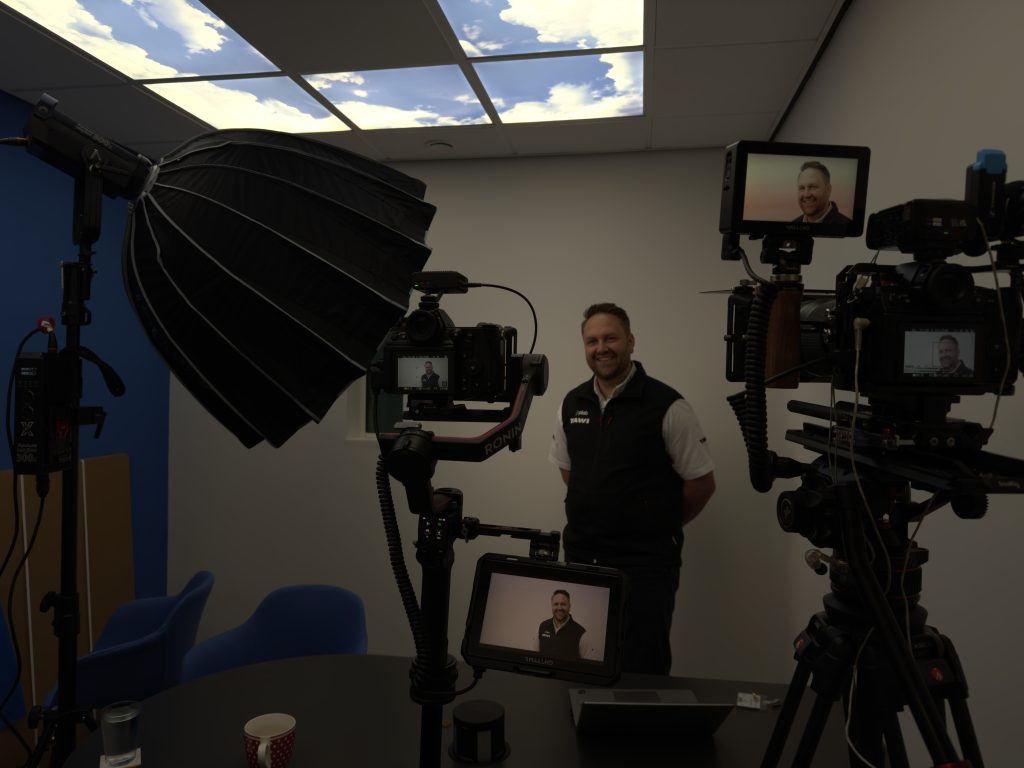 A typical video production company lighting and camera set up for filming an interview.