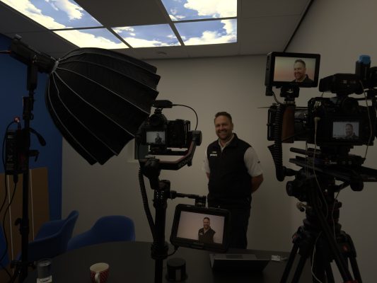 A typical video production company lighting and camera set up for filming an interview.
