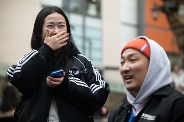 People smiling on set because they're working with a fun video production company